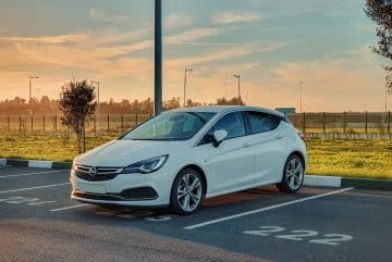 white honda sedan on road during daytime